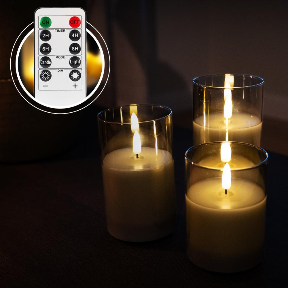 Set van 3 oplaadbare led kaarsen met grijs glas met afstandsbediening. Duurzaam en sfeervol, inclusief oplaadsnoer.
